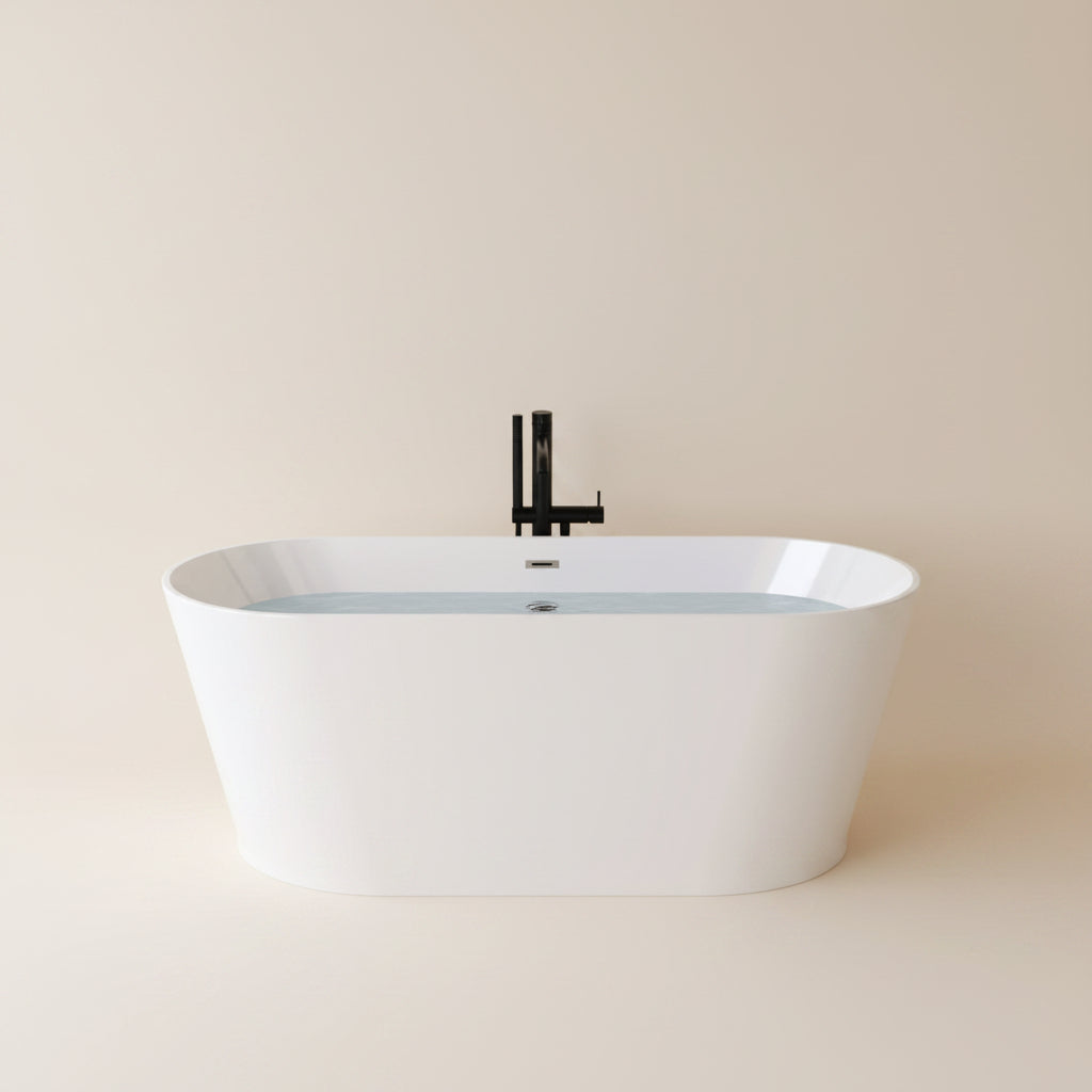 Modern bathroom with a freestanding bathtub against a marble wall.