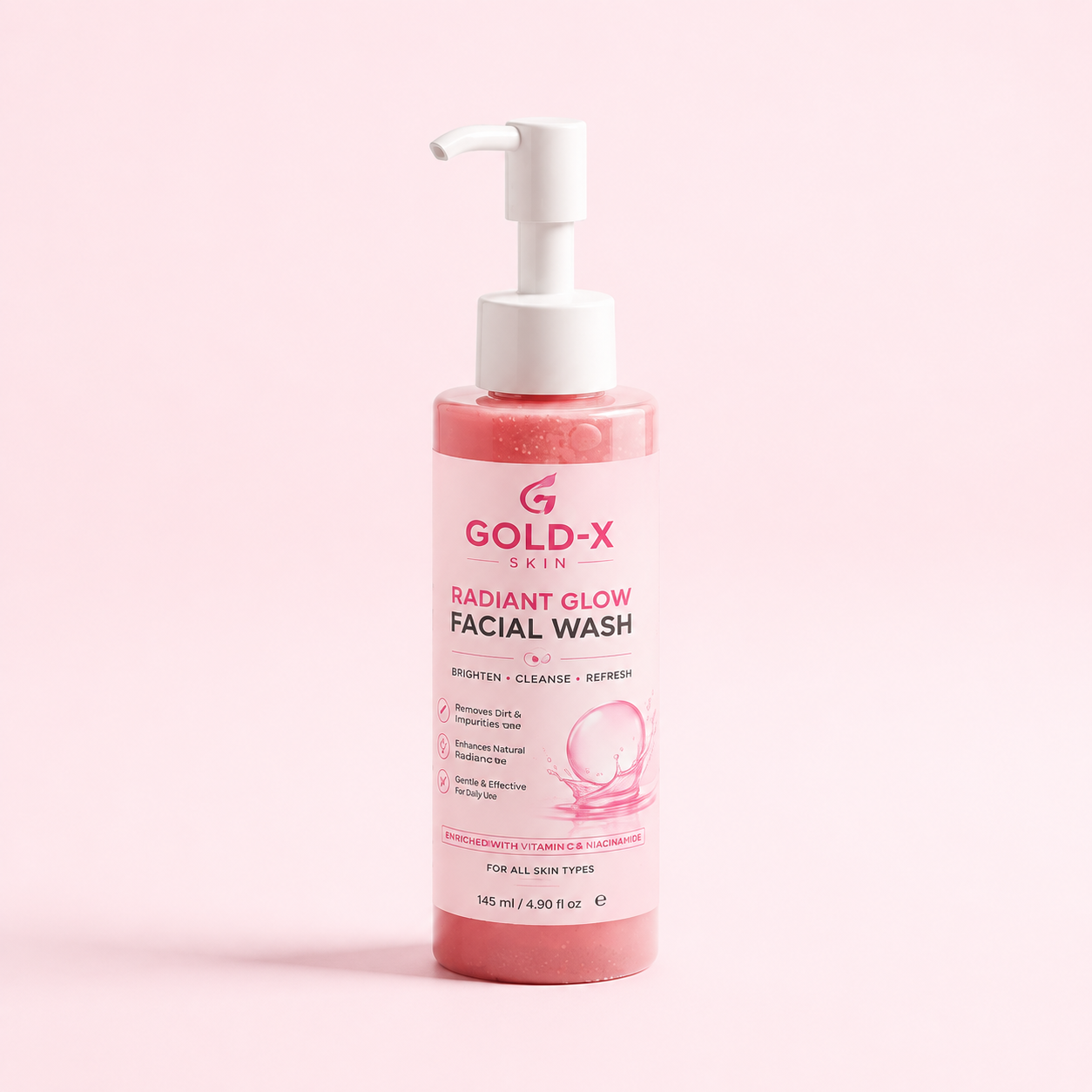 Gold-X Skin Radiant Glow Facial Wash in a pink pump bottle with a white dispenser, set against a solid light pink background.