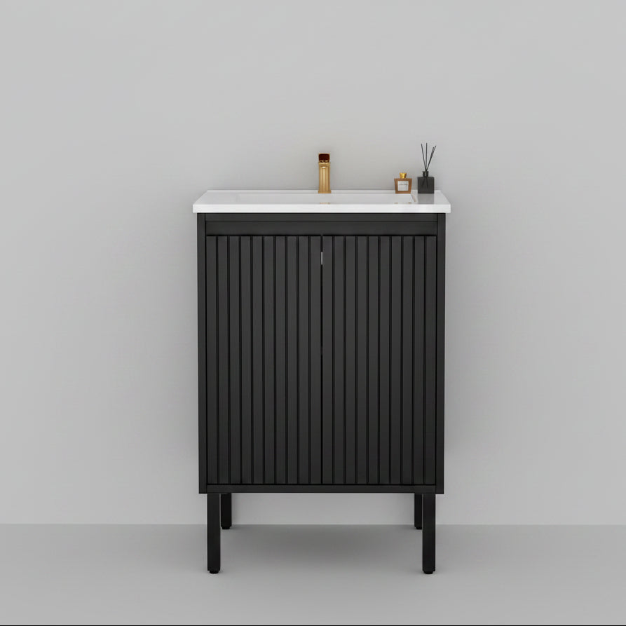 Bathroom with black vanity unit, white countertop, and marble walls.
