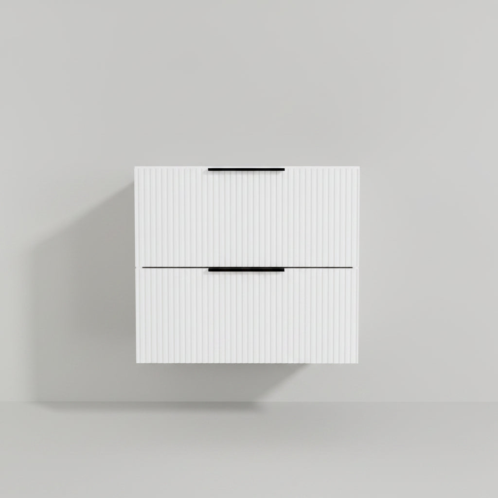White wall-mounted cabinet with black handles in a bathroom setting